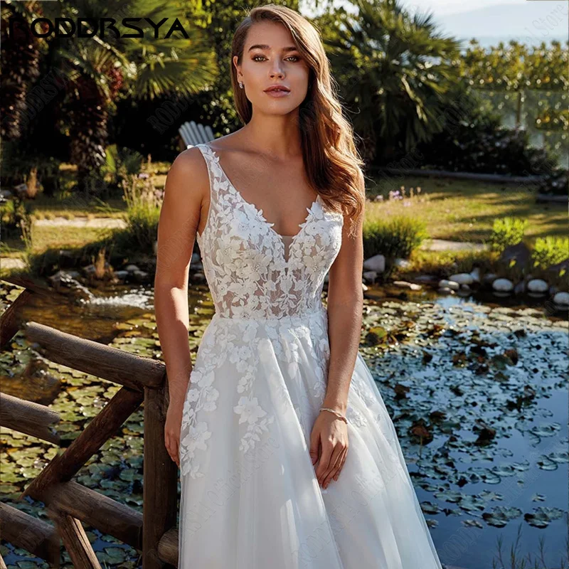 Roddrsya Beach Trouwjurken Applicaties Bandjes V-hals Bridal Partij Jassen Ruglooze Sweep Trein Robe De Mariee Fluide Custom Made Strand Bruidsjurken Appliques Straps V-hals Bruids Party Jurken Backless Sweep Train bad