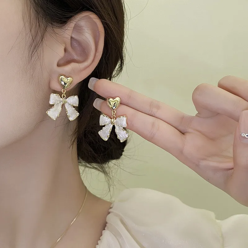 925 Silver Needle Korean Fashion White Bowknot Drop Earrings For Women Jewelry 2026 Trending New Women's Bow Heart Earrings M3