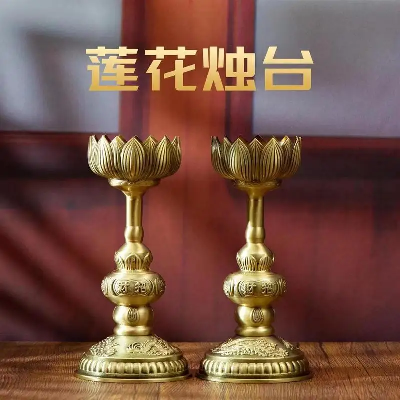 A pair of brass holders, lamps, and decorative lotus candle stands for Buddhist altars