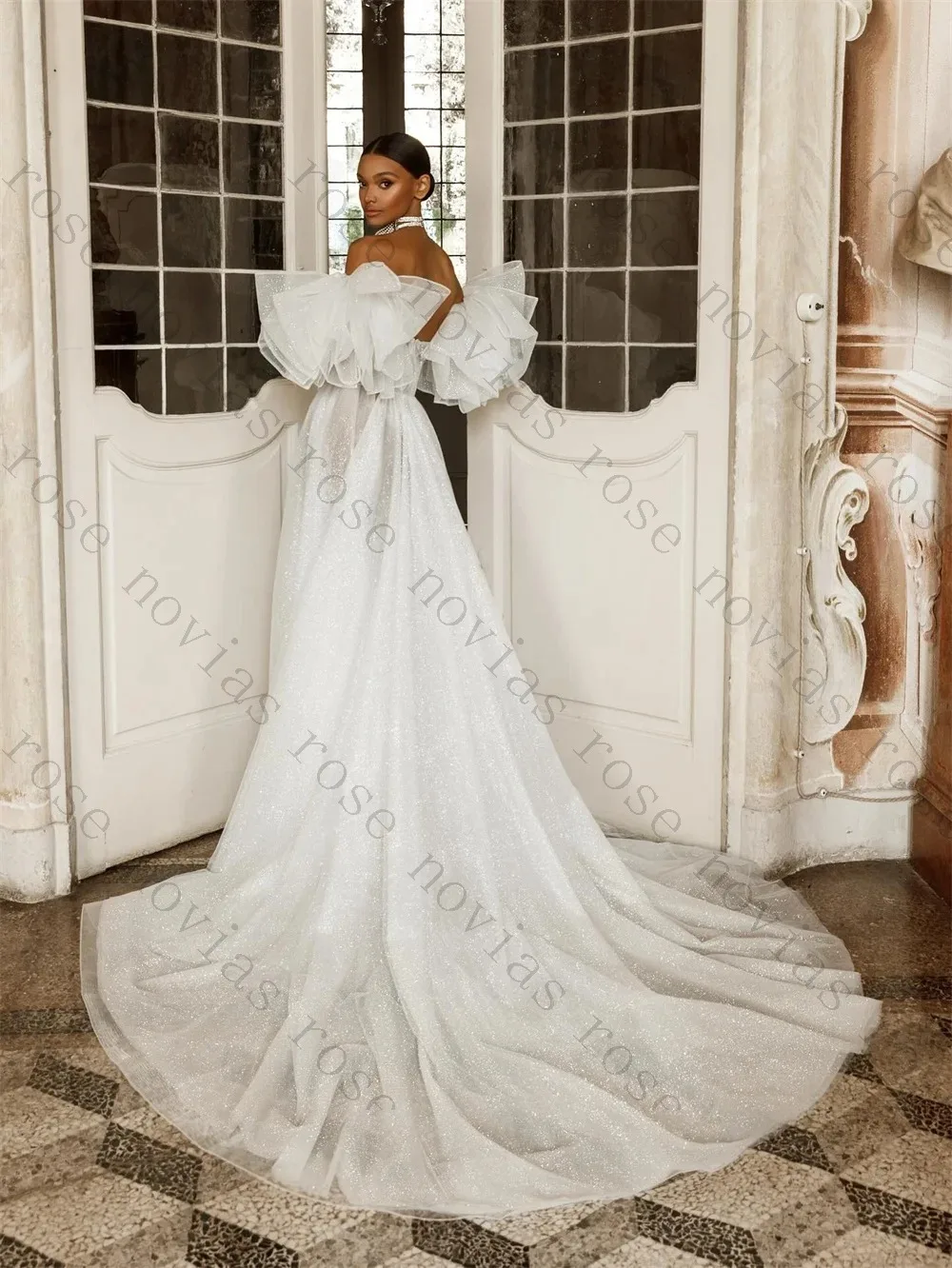 Customized White A-Line Off Shoulder Sparkle Wedding Dress 2026 with Ruffled Sleeves and High Slit for Glamorous Bridal Gown