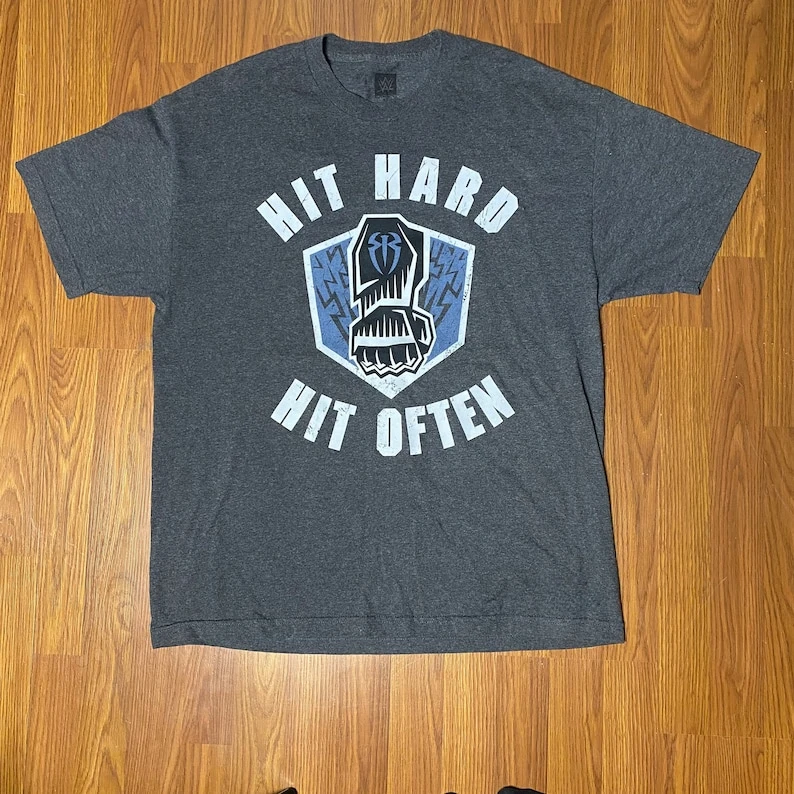 Authentic  Roman Reigns Hit Hard Hit Often T-shirt Licensed Wrestling Apparel