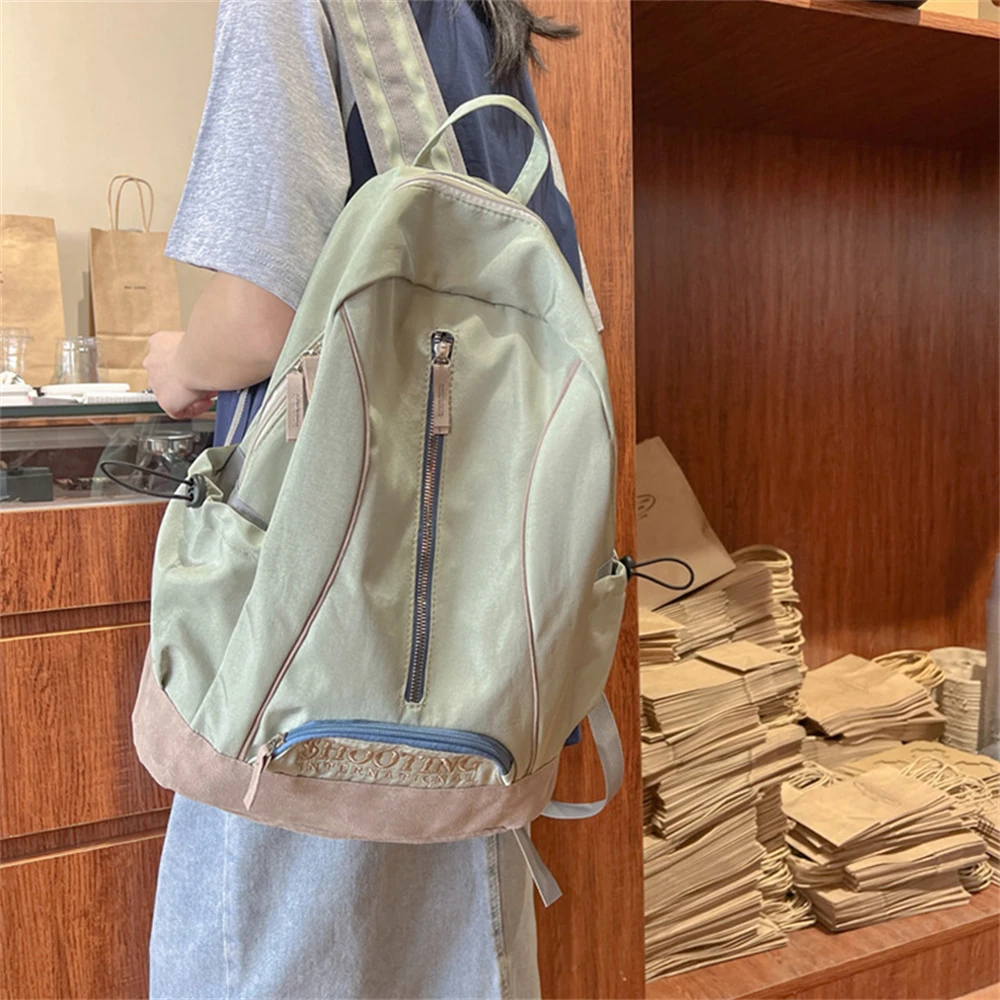 Bolso de mujer de Color sólido, mochila de nailon de alta calidad a la moda para mujer, nueva mochila para estudiantes de gran capacidad, Bolsos de viaje para mujer