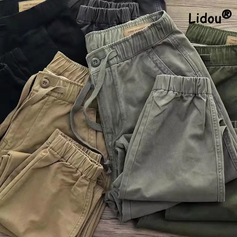 Przystojna moda jednokolorowa talia sznurkiem męskie spodnie Cargo nowe klasyczne legginsy młodzieżowe wszystkie mecze męskie wygodne spodnie