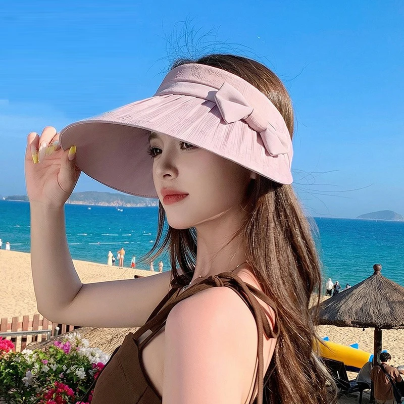 

Fashionable and elegant open-top hat for summer outdoor sun protection Large brim with a bow design suitable