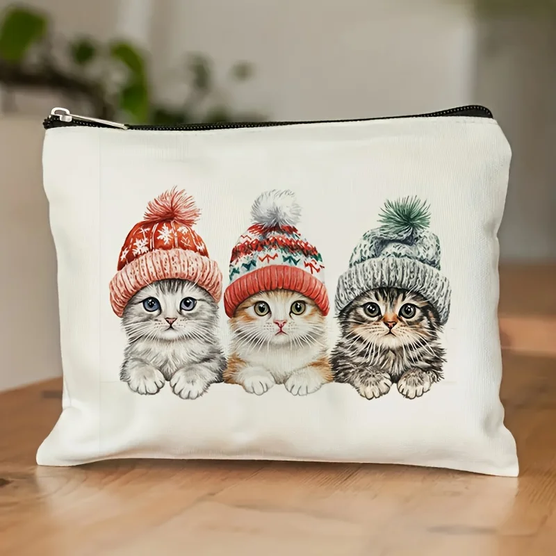 Zimowa kosmetyczka z motywem kociaka i kapelusza - urocza, wielofunkcyjna saszetka na zamek błyskawiczny, etui na biżuterię.