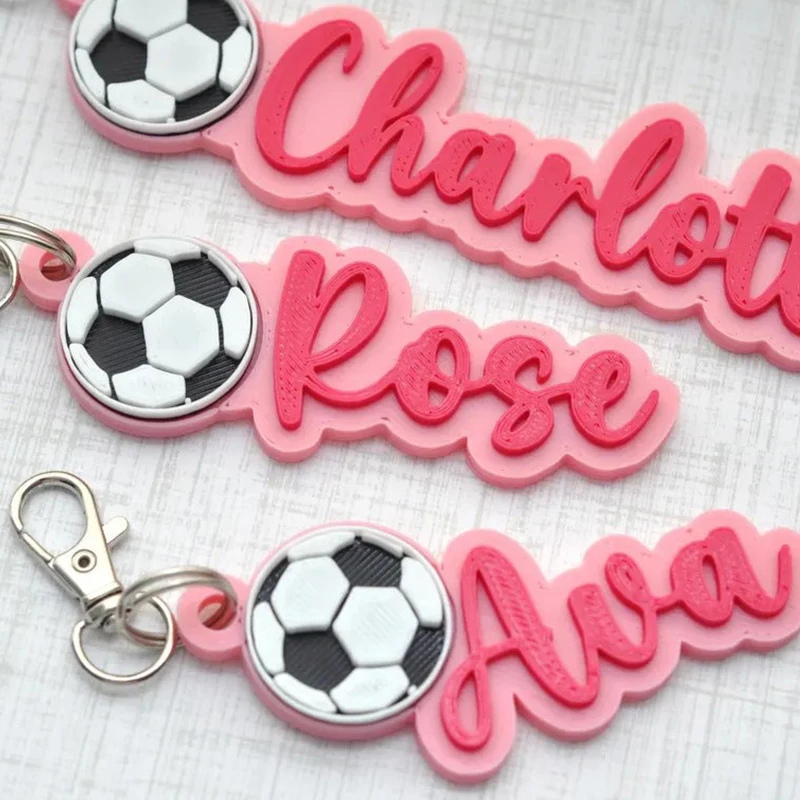 

Pink Color Custom Name Football Shape Acrylic Keychain in English Hebrew Couples Gift Personalized 3D Nameplate Backpack Keyring
