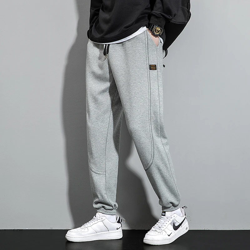 Fashion Solid Color Pockets Spliced Casual Pants Men's Clothing 2024 Spring Autumn New Loose Elastic Lace Up High Waist Trousers