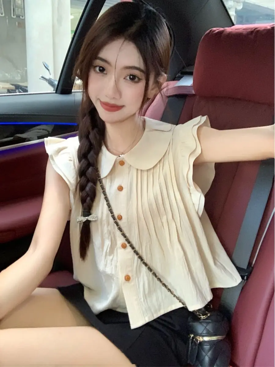 新しいドールネック小さなフライングスリーブプリーツボタンカーディガンはスリムでファッショナブルに見えますルーズシャツ薄いトップコットンリネン