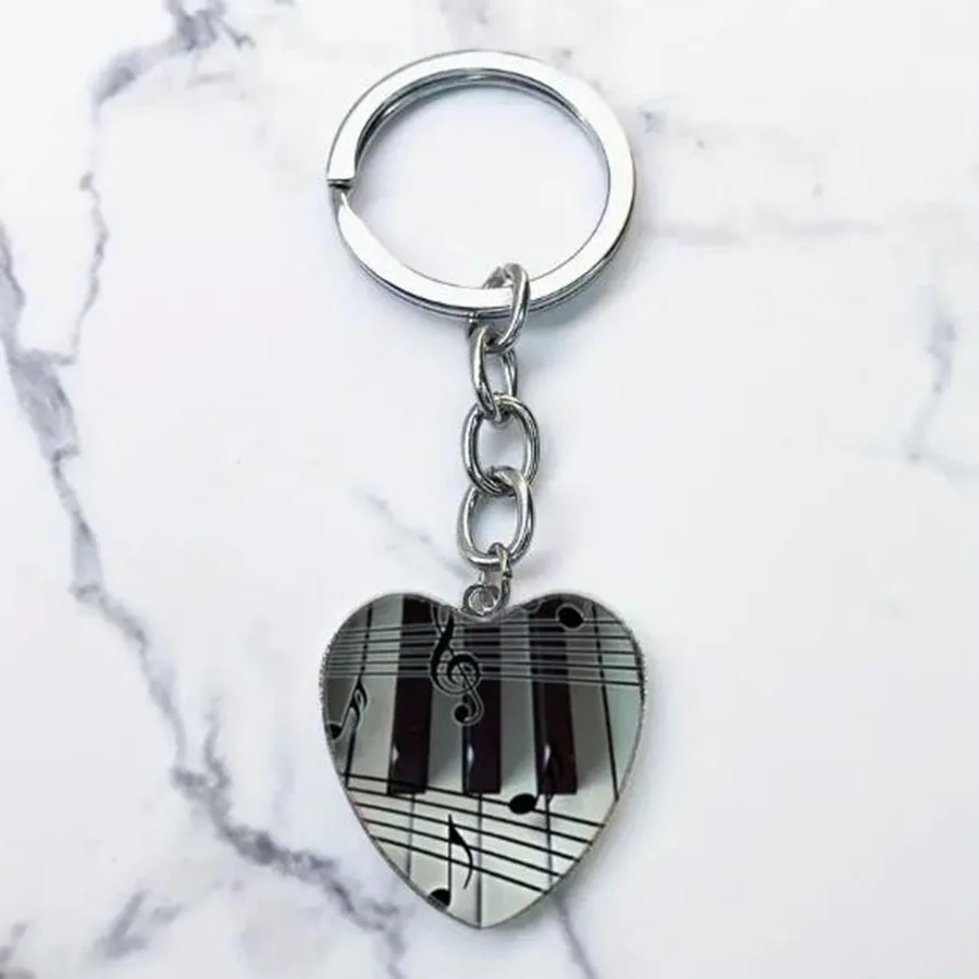 Heart shaped piano keychain paired with a glass alloy pendant is the perfect gift for music enthusiasts and musicians