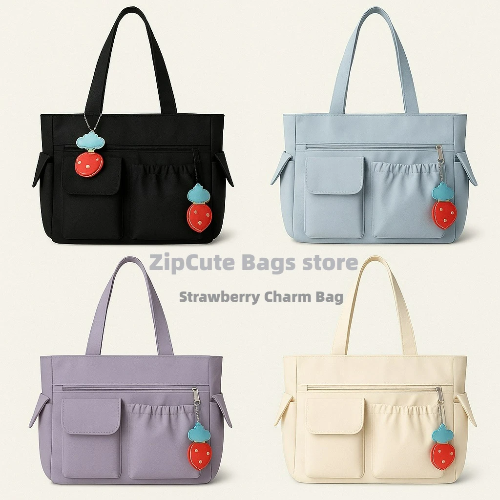 

2025 new solid color simple versatile bag strawberry pendant cute hand bag college students commuting shoulder bag large capacit
