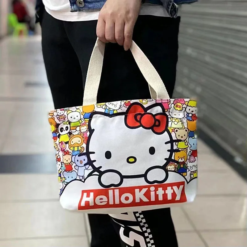 Sanrio Hello kittys กระเป๋าถือการ์ตูนน่ารักอะนิเมะ Kawaii สร้างสรรค์พิมพ์อเนกประสงค์เดินทางกระเป๋า tas Jinjing kanvas แบบพกพาของเล่นสำหรับเด็กผู้หญิงของขวัญ