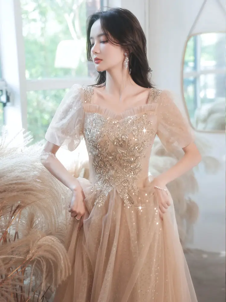 

Champagne Evening Dress Woman 2024 New Temperament Light Luxury Small Arts Test Senior Sense Banquet Engagement Dress Host