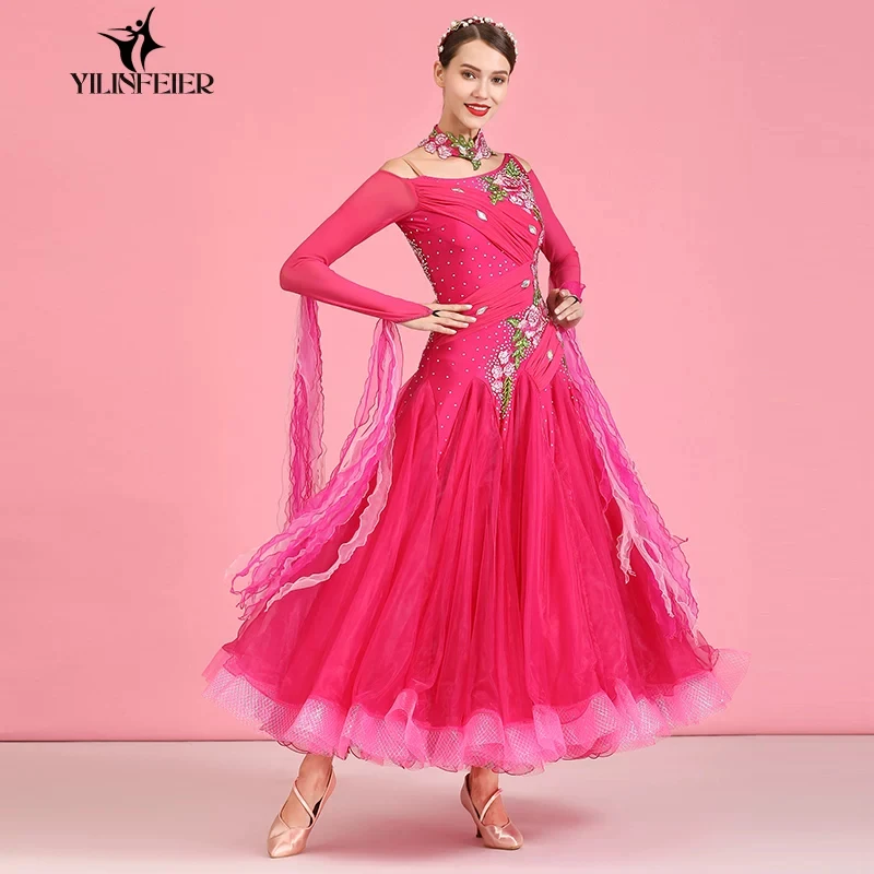 Ballroom dance competition dress with asymmetrical off‑shoulder long sleeves,floral rhinestone decor,floating ribbons and multi‑