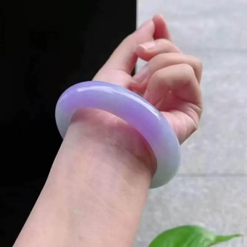 Jade bracelet, ice-like texture, with a violet hue and greenish undertones, showcasing the vibrant colors of spring
