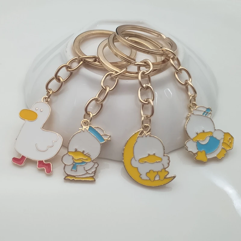 

Cute enamel little yellow duck keychain dancing duck keychain couple ladies friend gift bag pendant accessory keychain