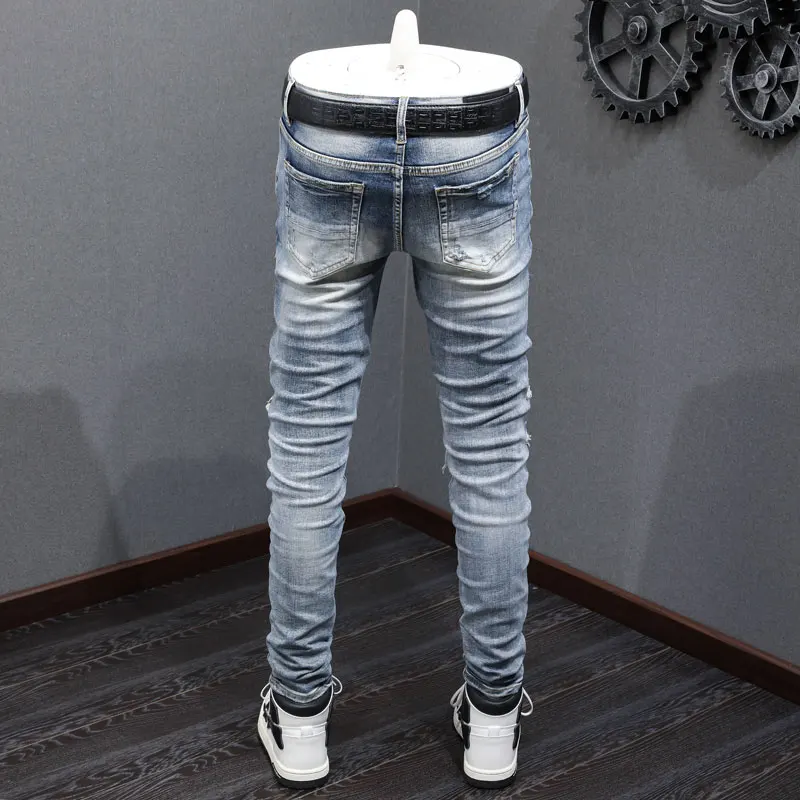 Fashionable new men's light blue jeans with stretch, slim fit, washed and spliced leather jeans, high street hip-hop brand desig