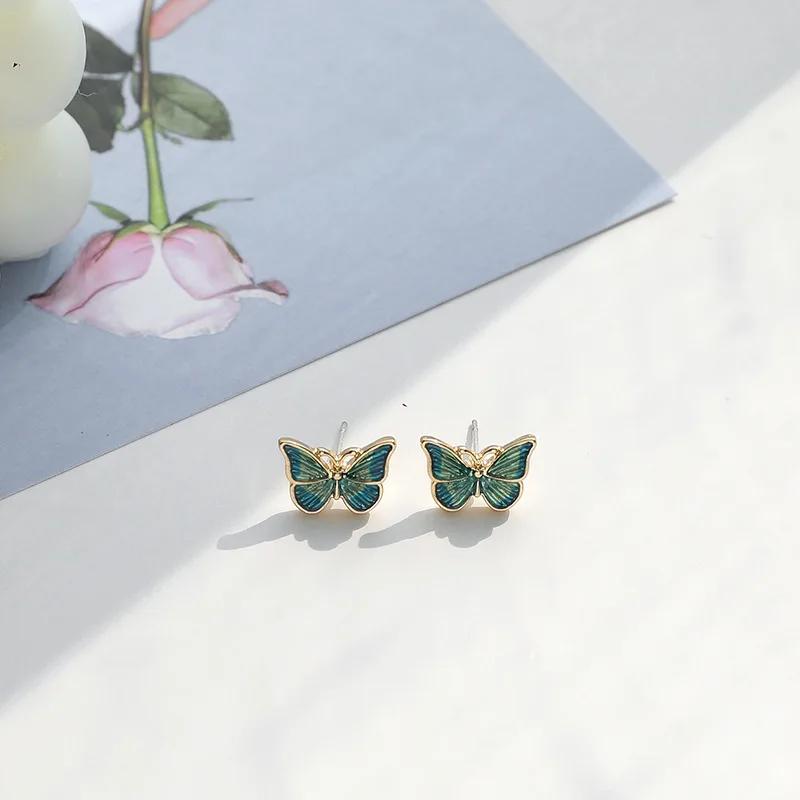 Los fabricantes de pendientes coreanos venden pendientes de mariposa de estilo de pintura al óleo suaves y flexibles, nuevos pendientes versátiles