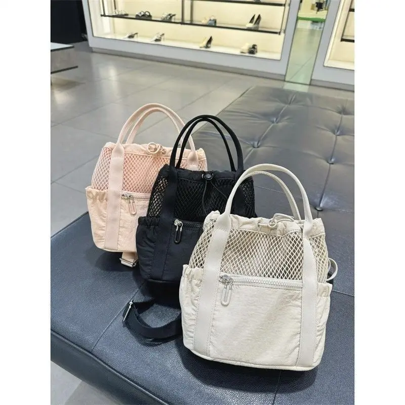 

Mesh Backpack for Women 2025 New Niche Handheld Commuting Drawstring Tote Bag Versatile Small Backpacks