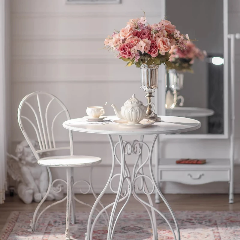 

Retro wrought iron old tables and chairs, rural outdoor leisure tables and chairs