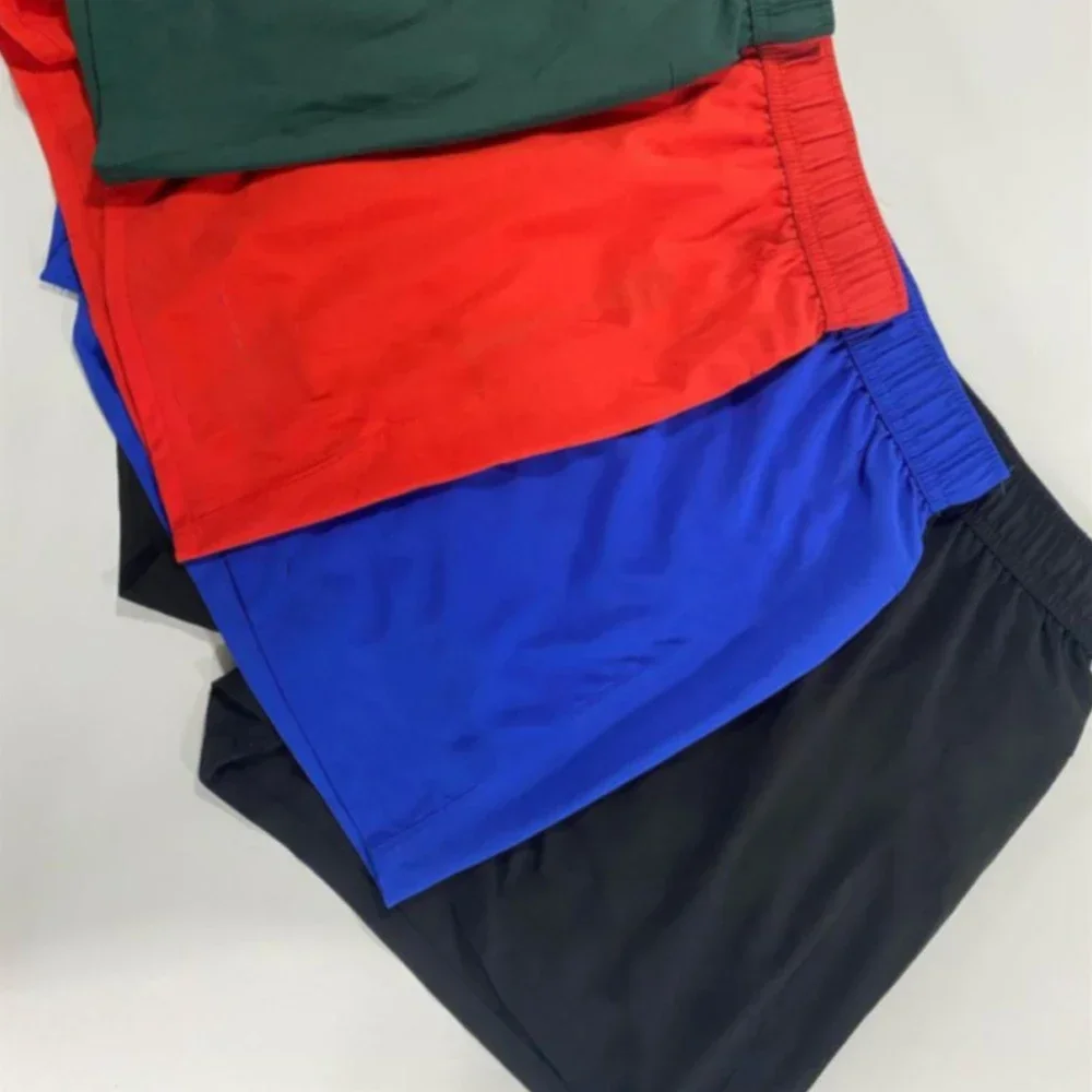 Pantalones cortos de poliéster con cordón para hombre, pantalones cortos transpirables de Color sólido, deportes al aire libre, correr, baloncesto,