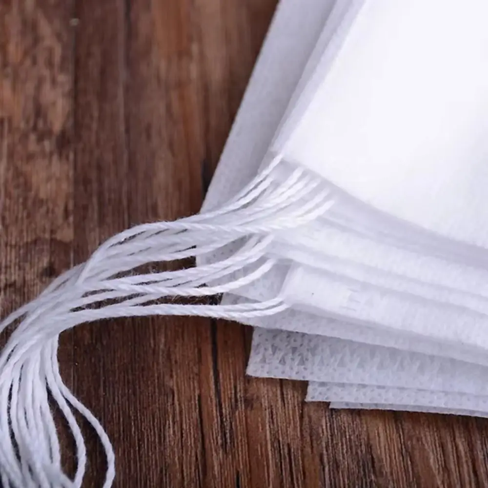 

100Pcs Drawstring Disposable Coffee Pouches Non-woven Fabric Drawable Tea Filter Bags with String Transparent Multi-size