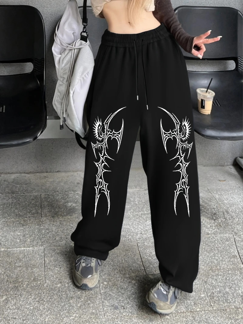 

Шикарные повседневные спортивные штаны с принтом крыльев — черный полиэстер, эластичный пояс с завязками, прямые штаны, можно стирать в машине