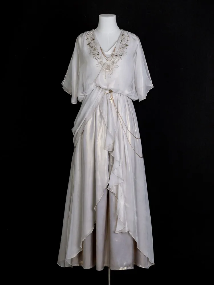 

A stylish and elegant cape dress set with sense of design