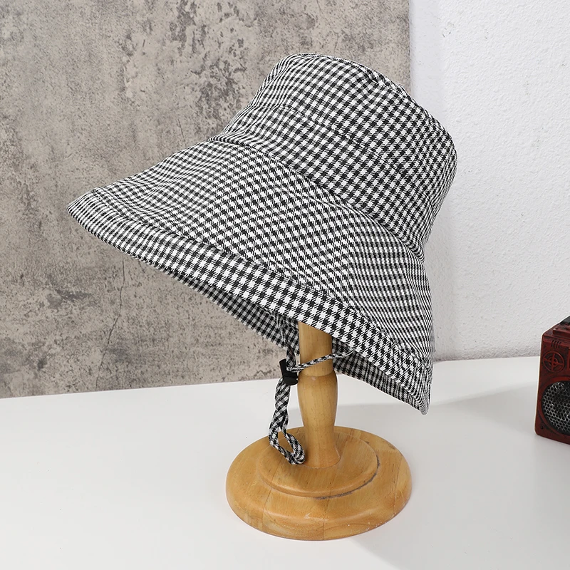 Lady's stylish collapsible summer beach sun hat, comfortable and lightweight, with a rope-attached wide brim