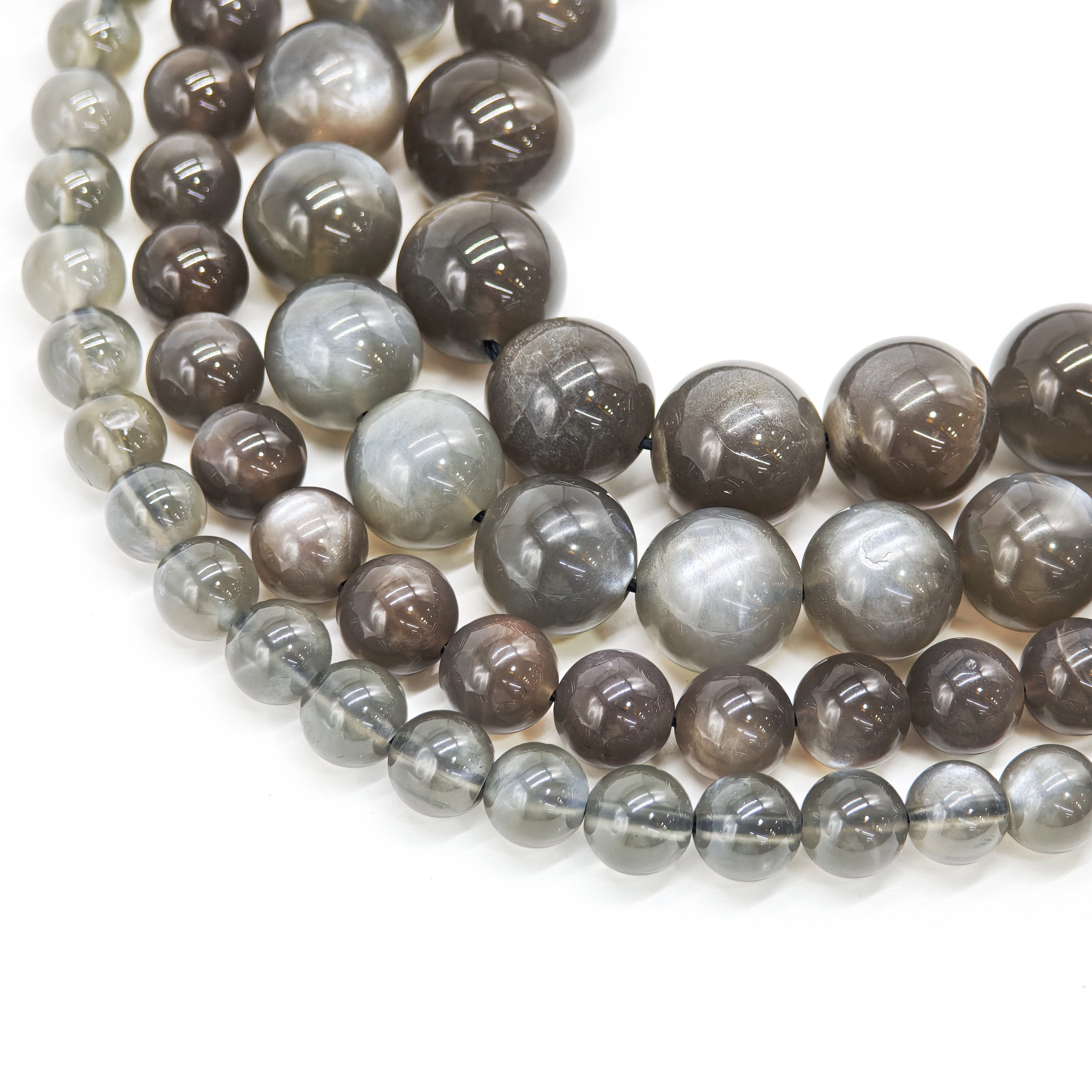 

Natural Gray Moonstone, round loose beads sized 6 - 12mm. Bulk discounts available. For DIY jewelry lovers & collectors.