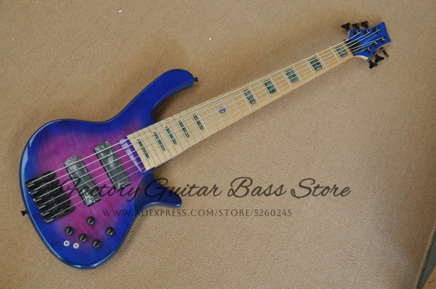 

Blue-purple bass, 6-string electric bass, ash wood body Flamed maple top, mother shell fingerboard inlay, black fixed bridge,