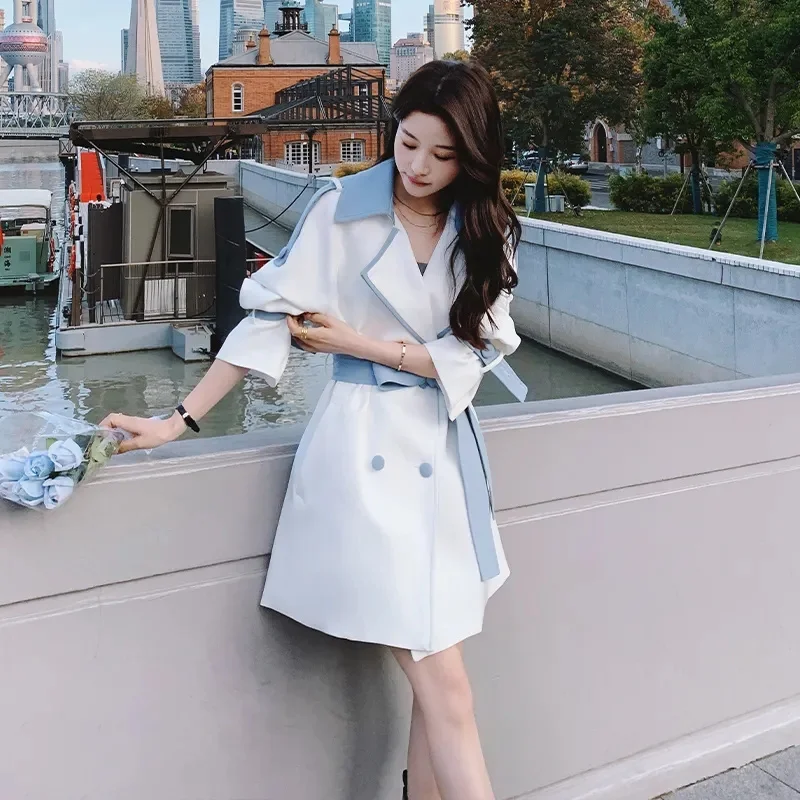 

Korean Version Of The Long Contrast Windbreaker Coat Women The Spring Autumn Of 2023 The New Waist-Tied Windbreaker Coat is Slim