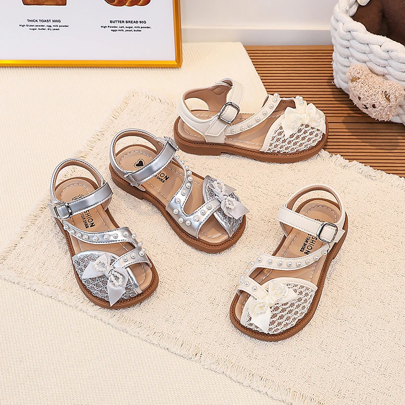 

Toddler Girls Beaded Strap Sandals with Cute Bow 2026 New Summer Kids Mesh Beach Shoes Soft Sole Trendy Princess Party Dress Up