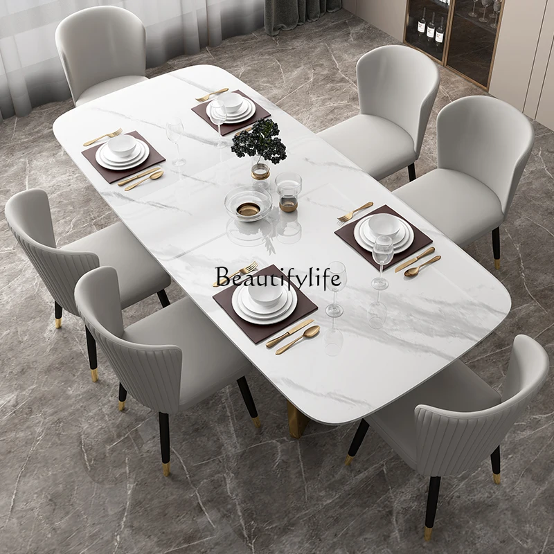 

Bright rock slab dining table Italian light luxury modern simple rectangular marble dining table and chair combination