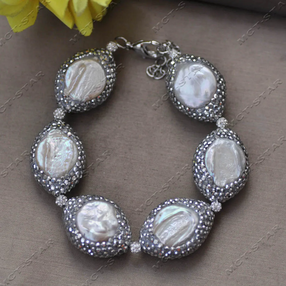 

Браслет MTC·STAR 10'' с белым пресноводным жемчугом 28 мм и фианитами «Ангельский глаз» (Z14512)