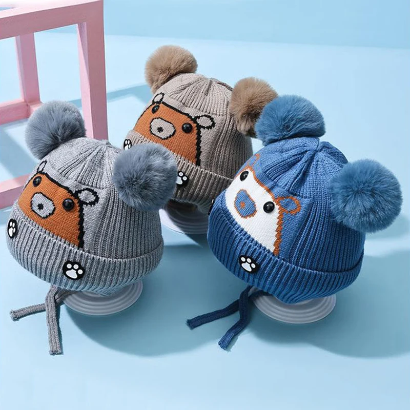 

Cute Cartoon Baby Earmuffs Cap Plush Ball Children Ear Protection Hat 2-6year Baby Winter Woolen Warm Knit Hats Lace-up Beanies