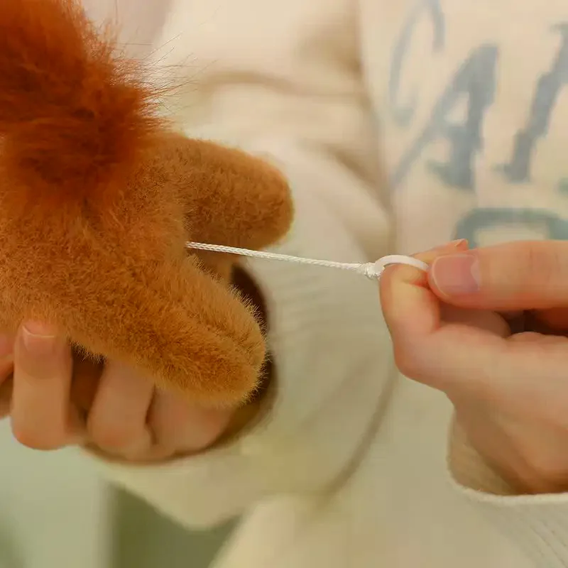 Lindo y esponjoso 12cm cuerda de tracción Wag cola caballo llavero de juguete de peluche de dibujos animados muñeco de peluche suave colgante llave de coche mochila bolsa Accesorios