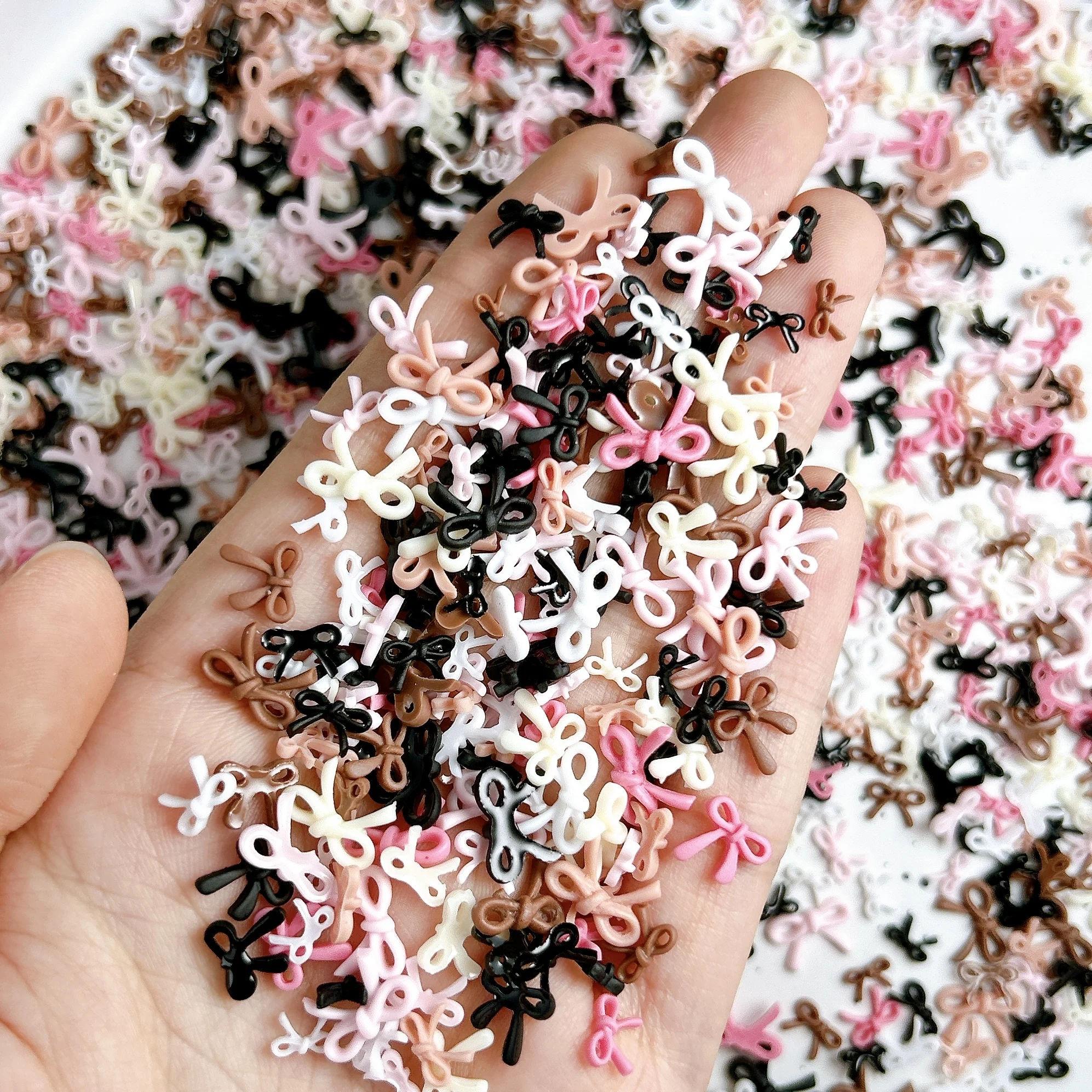 50PCS Sweet Solid Color Line Bows Nail Charms Multi Sized Hollowed Bowknots Resin Nail Art Decorations for DIY Nails Ornaments