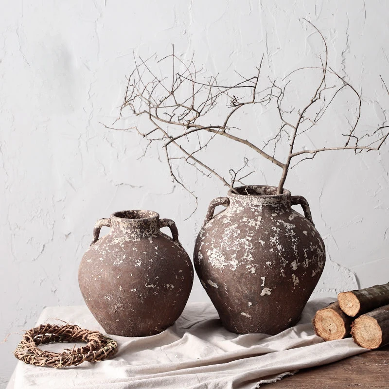 

Hand-made rough pottery ware with flowers to make old pottery pots