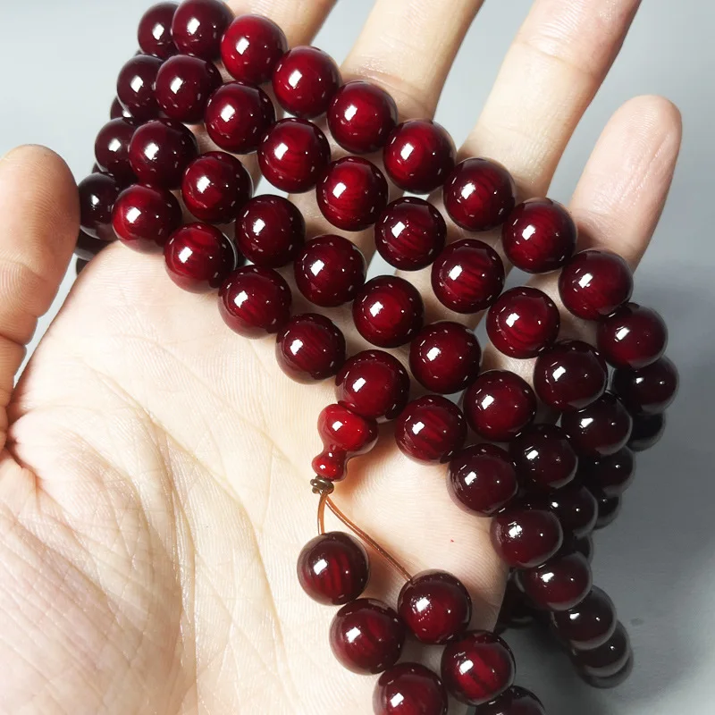 Amber wood 108 red oil blood dragon multi-loop cultural toy bracelet with translucent pine seeds, solidified, for men