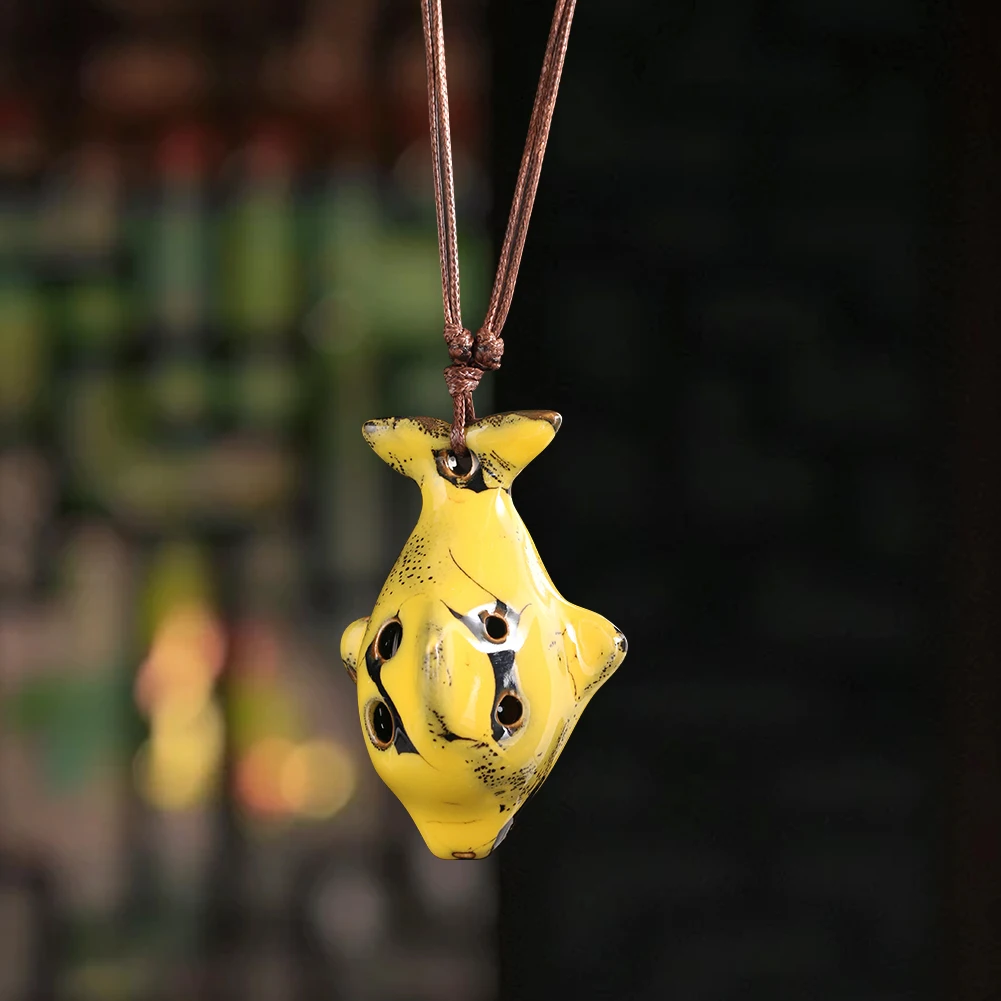 

Portable Yellow Fish shaped 6 Hole Ocarina Whistle painted Ceramic Ornament with Rope for Decoration and Music Practice
