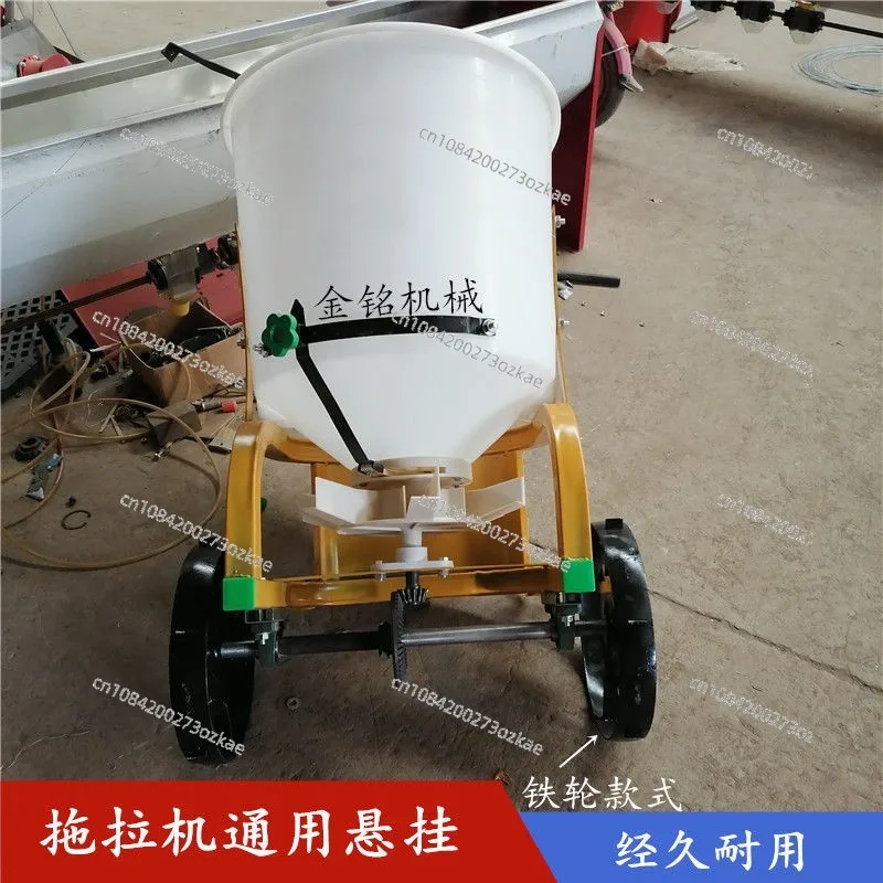 

The Fertilizer Spreader Bucket Is Suspended and Then Pulled, and The Fertilizer Spreader Is Towed.
