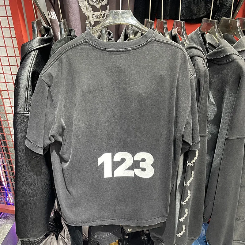 2026 الصيف الرسومات شعار طباعة RRR123 تي شيرت خمر غسلها أسود قصير ولكن واسعة RRR 123 تي شيرت تي شيرت للرجال والنساء