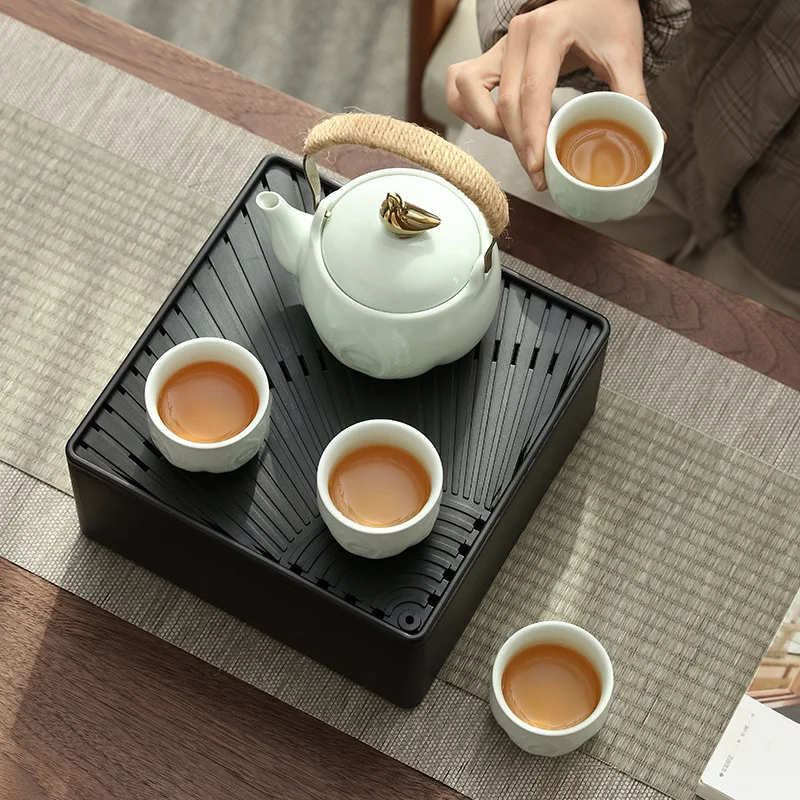 

High end travel tea set, ceramic travel set, one pot, four cups, lifting beam teapot with bag tea set