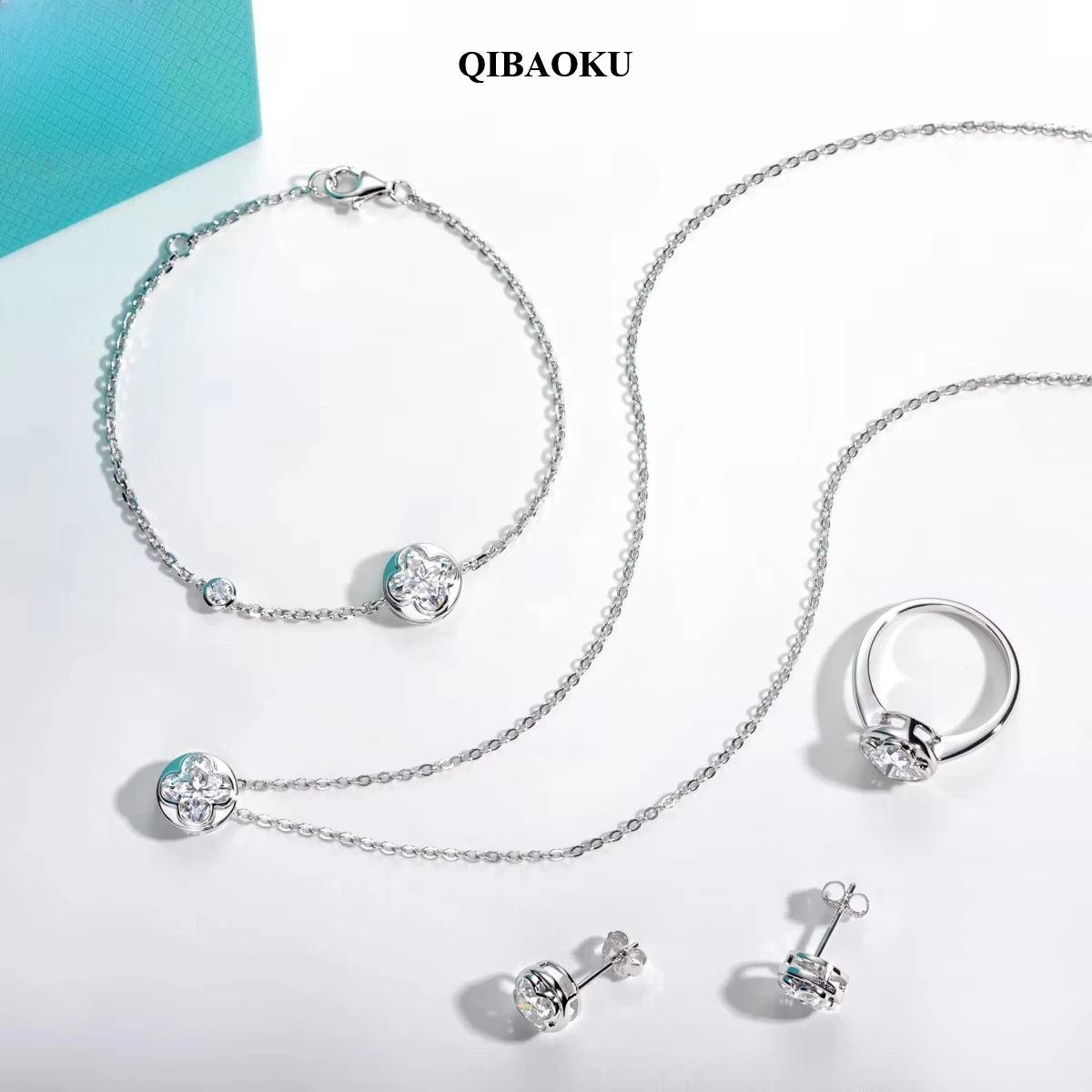 QIBAOKU Four-Leaf Clover Moissanite Bezel Ring Necklace Bracelet Earrings S925 Sterling Silver Jewelry Set for Women 2026