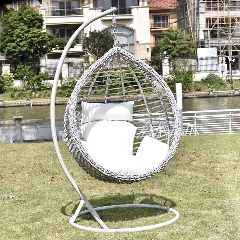 

Cozy Outdoor Rattan Swing Chair - Perfect for Relaxation on Balcony, Courtyard, Garden, or in Hotel