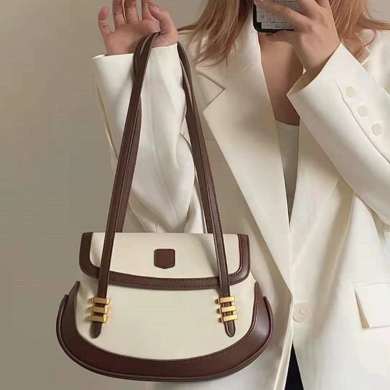 

French Pu Retro Light Luxury Saddle Bag 2024 New Handle Boston Package Niche Designer Soft Leather Shoulder Underarm Bowling Bag