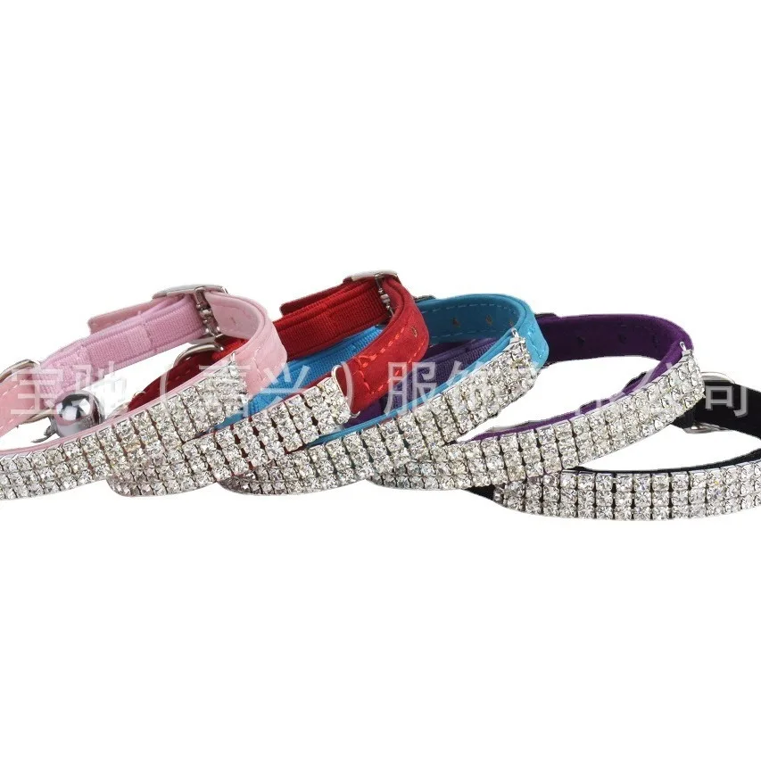 A row of diamond-encrusted pet collars, artificial rhinestones, flocked dog collars, elastic straps, cats.