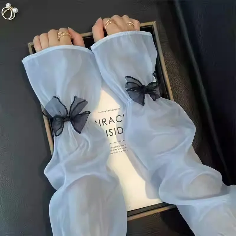 Les manches de protection solaire sont douces et mignonnes avec un nœud papillon unique offrent un look délicat, doux et haut de gamme.