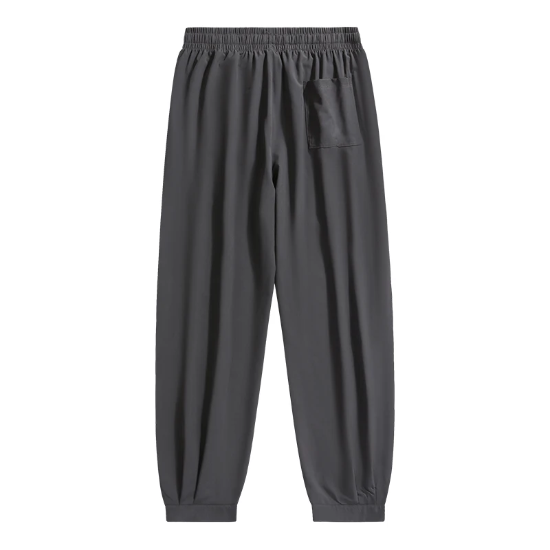 New trend summer men's solid color pocket drawstring elastic casual ice silk leggings loose wide leg cropped sports pants