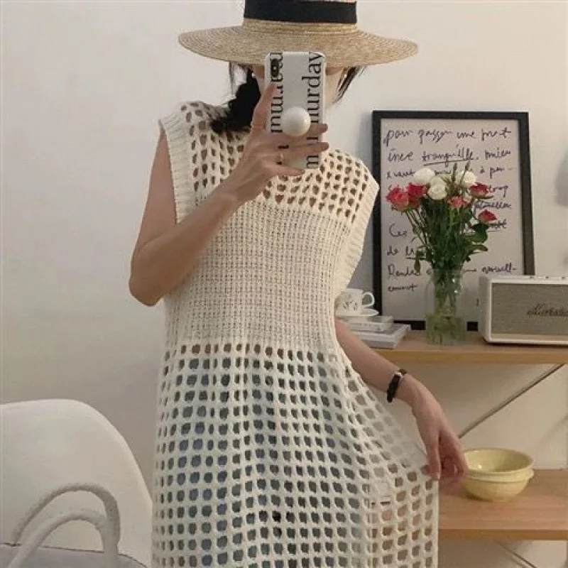Vestido suéter feminino de malha em camadas cor sólida oco solto sem mangas colete vestido em torno do pescoço estilo viajante vestido 2025 novo